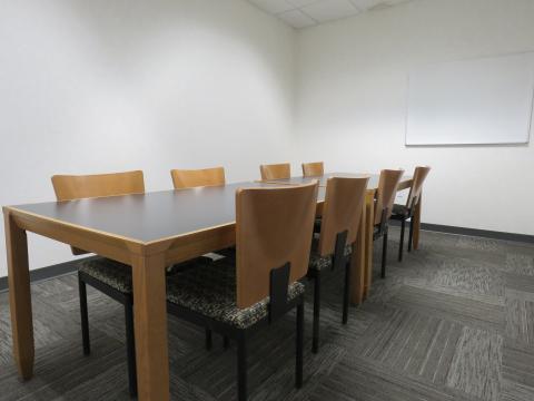 Study Room with tables, chairs, and dry erase board