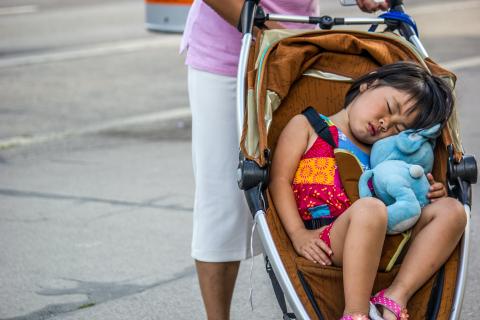 Toddler asleep in stroller